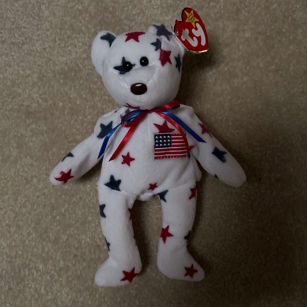 Ty Beanie Baby Glory.  Inside says “Oh say can you see…”.